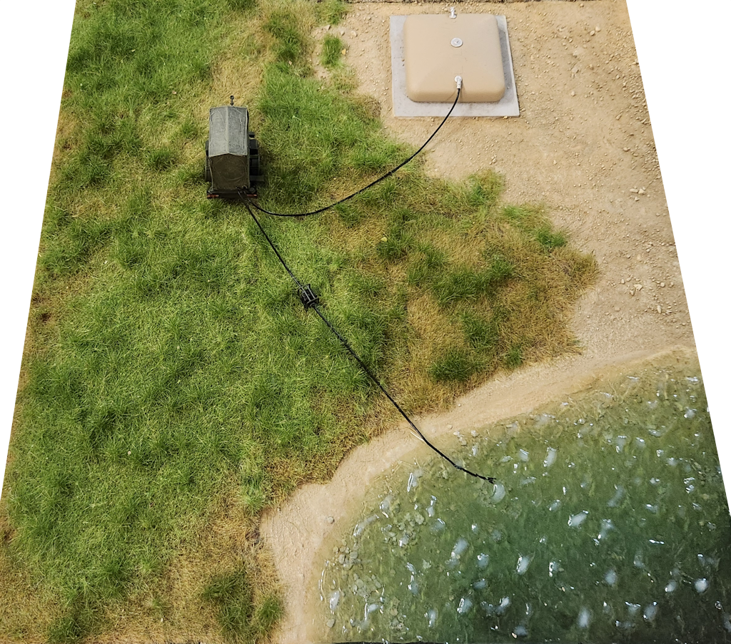 Pronal diorama featuring a landscaped area, a path, and an aquatic environment