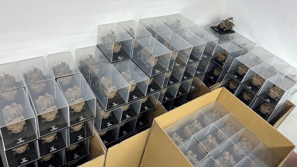 A series of 1/24-scale UNAC Fardier model kits, individually packaged in clear display boxes