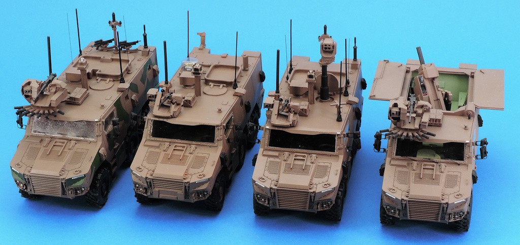 Four scale models of the VBMR Griffon in the standard, OTM, VOA, and MEPAC versions, shown from left to right by the Arquus / KNDS / Thales consortium